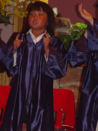 Kasen singing songs at Graduation